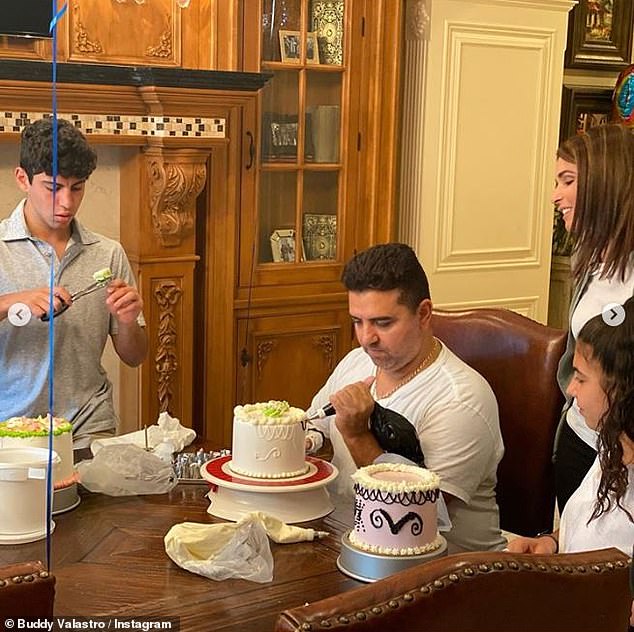 Once again: Cake Boss Buddy Valastro is back at work as he trained to decorate a cake with his left hand on Saturday, after a horrific bowling accident at home