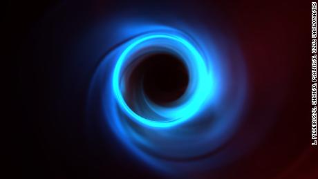 This is a simulation of the M87 black hole showing the motion of plasma as it orbits around the black hole.  The thin, shiny ring that can be seen in blue is the edge of what researchers call a black hole's shadow.