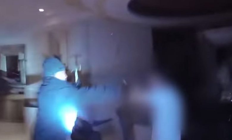 A screenshot from Bodycam depicting Las Vegas officers shooting a suspect in the robbery