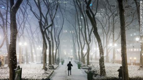 People walking in a snowstorm in New York City on Wednesday.