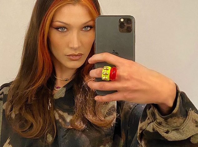 Informal glamor: Bella Hadid wore her glamorous look on Sunday with a casual headdress in an impromptu selfie mirror she posted on Instagram, after she revealed a new red hairstyle.