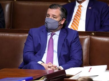 Senator Ted Cruz sits in the House of Representatives during a joint session of Congress on January 6, 2021, after protesters stormed the Capitol and disrupted a joint session to certify President-elect Joe Biden's 306-232 electoral college victory over President Donald Trump.