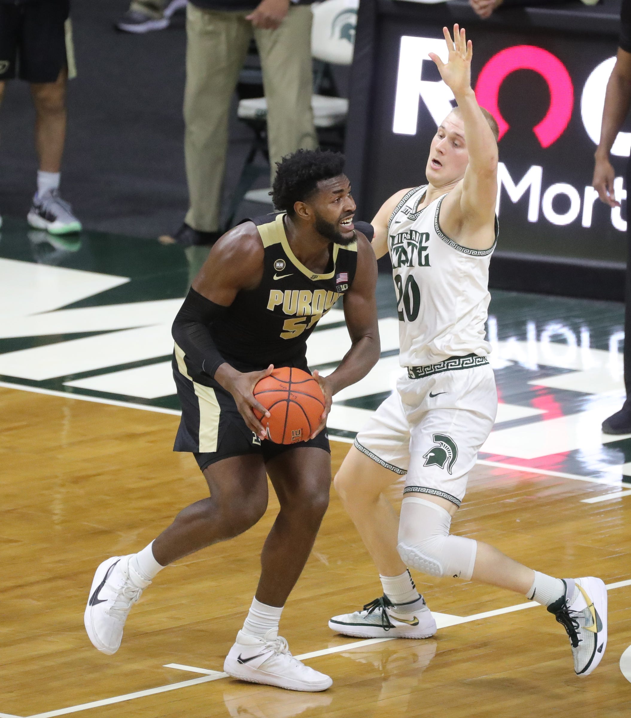 Michigan state striker Joy Hauser defends Purdue Boilermakers Trevion Williams during the second half at Priceline Center in East Lansing, Friday Jan 8, 2021.