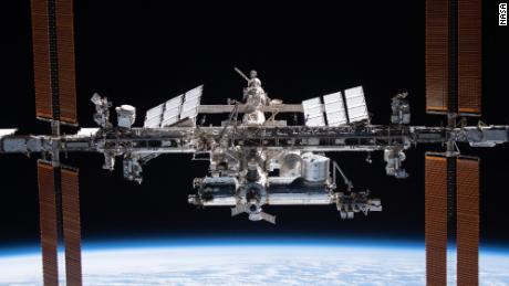 Photo of NASA astronauts perform spacewalks to provide power upgrades for the space station