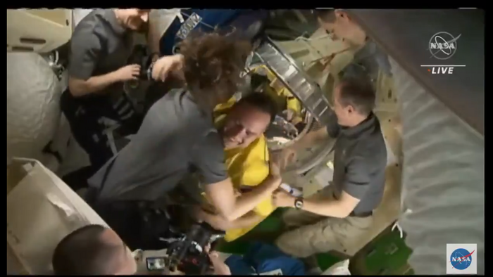 Three Soyuz astronauts on the International Space Station, greeted with smiles and hugs - Space and Astronomy
