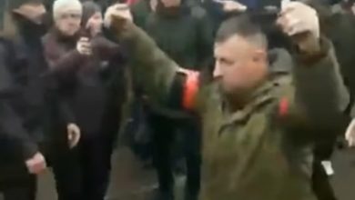 Photo of Ukraine … a Russian soldier walking with two hand grenades demands surrender, and the crowd insults him: “Shame”