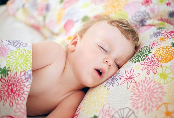 Baby sleeping with mouth open