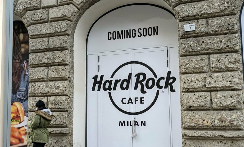 How and when will the Hard Rock Café open in Milan (employing 100 people)