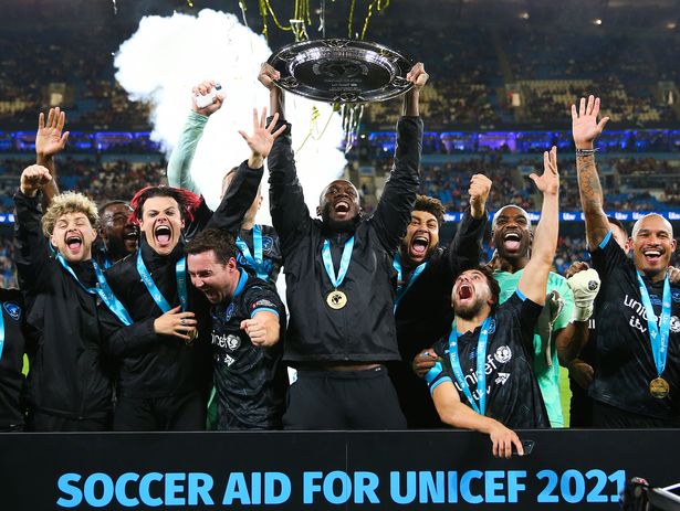 MANCHESTER, ENGLAND - SEPTEMBER 4: Usain Bolt of World XI raises the Soccer Aid Trophy with his teammates during Soccer Aid for UNICEF 2021 at the Etihad Stadium on September 4, 2021 in Manchester, England.