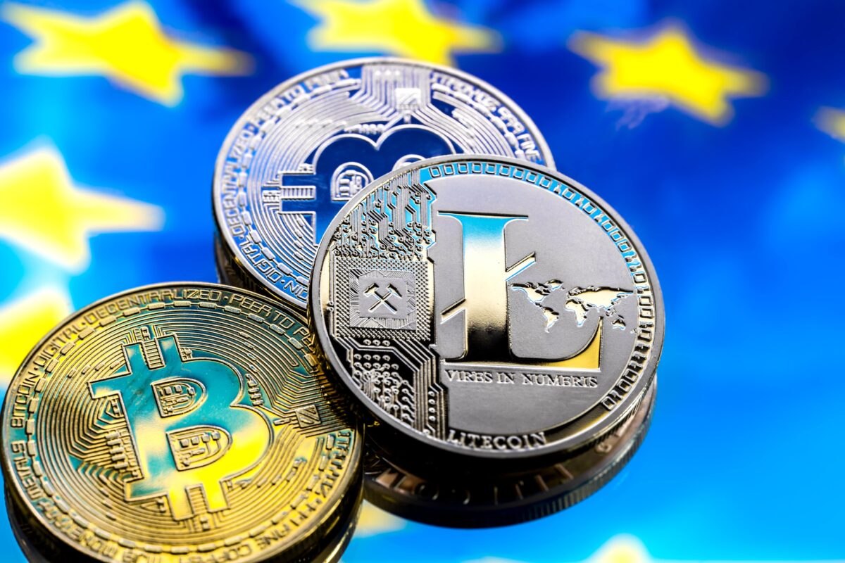 bitcoin and litecoin against europe background and european flag virtual money concept close-up minute