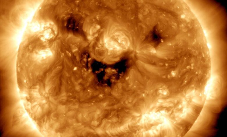 The sun is smiling and standing on the NASA telescope
